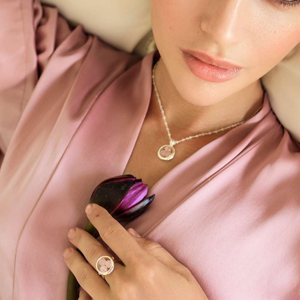 Crafted from premium Ring Crystal Peace Rose Quartz, add a touch of elegance to any look.