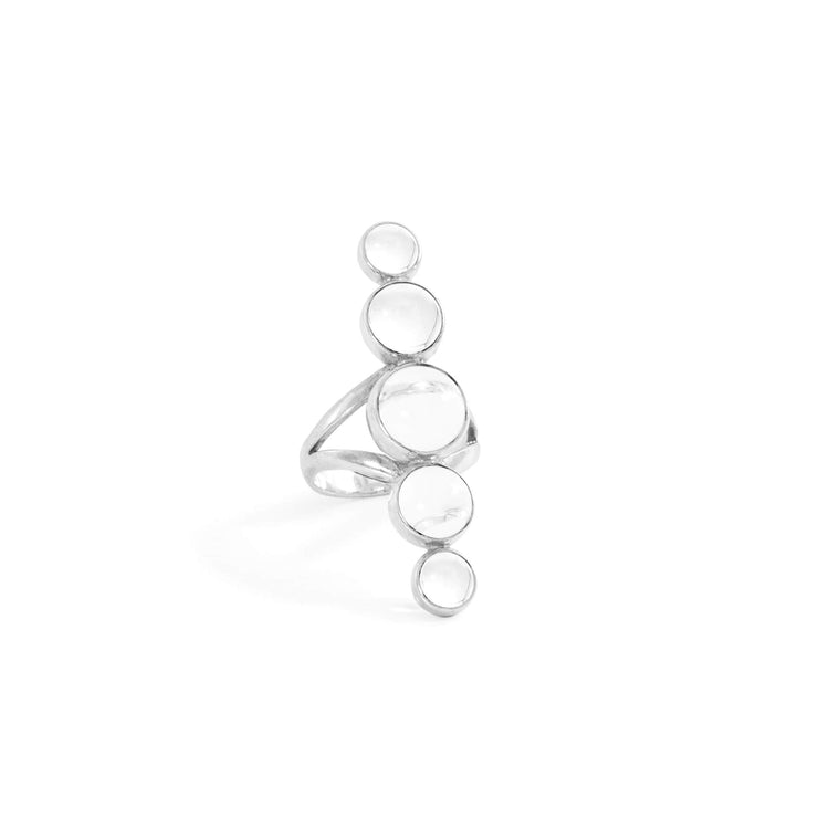 The Silver Ring Harmony with Crystal Sphere Gemstones from Kaora Sandara Jewelry, crafted from sterling silver 925, elegantly features five circular crystal stones arranged vertically in ascending order of size. This sophisticated piece is displayed upright against a pristine white background.