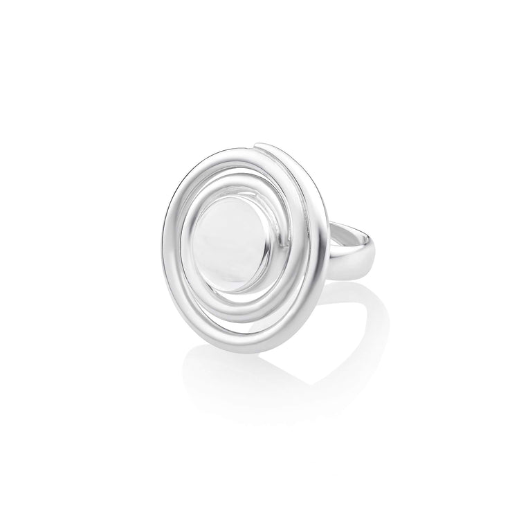 The "Silver Ring Open Spiral with Crystal - Size M" by Kaora Sandara Jewelry showcases a sterling silver design with circular, concentric rings and a smooth central dome that captures the essence of clarity against a plain white background.