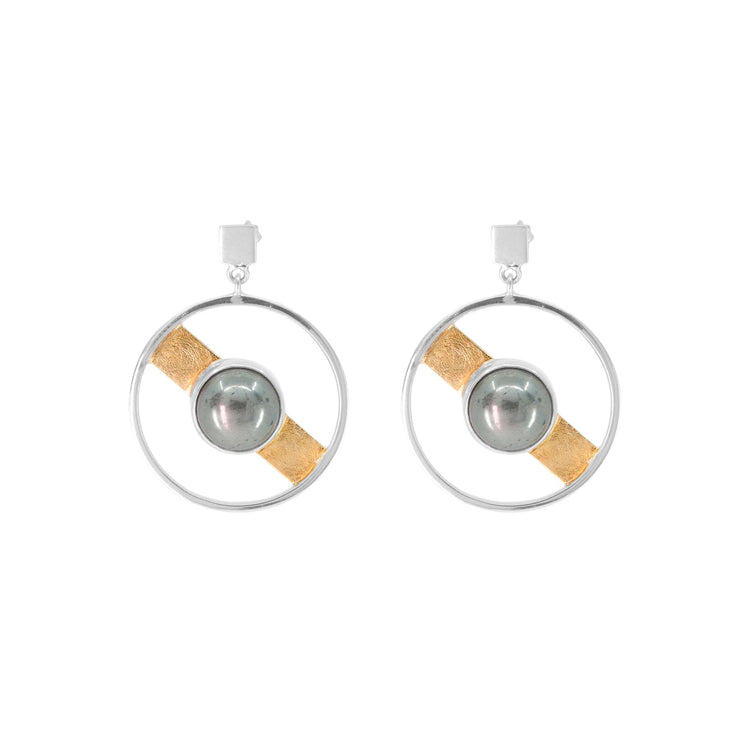 Introducing the Animus Earstuds by Kaora Sandara Jewelry: these sterling silver earstuds feature circular frames adorned with a central pyrite stone, elegantly encircled by a gold-plated band. Infused with masculine qualities, they boast silver stud attachments that perfectly balance elegance and strength.