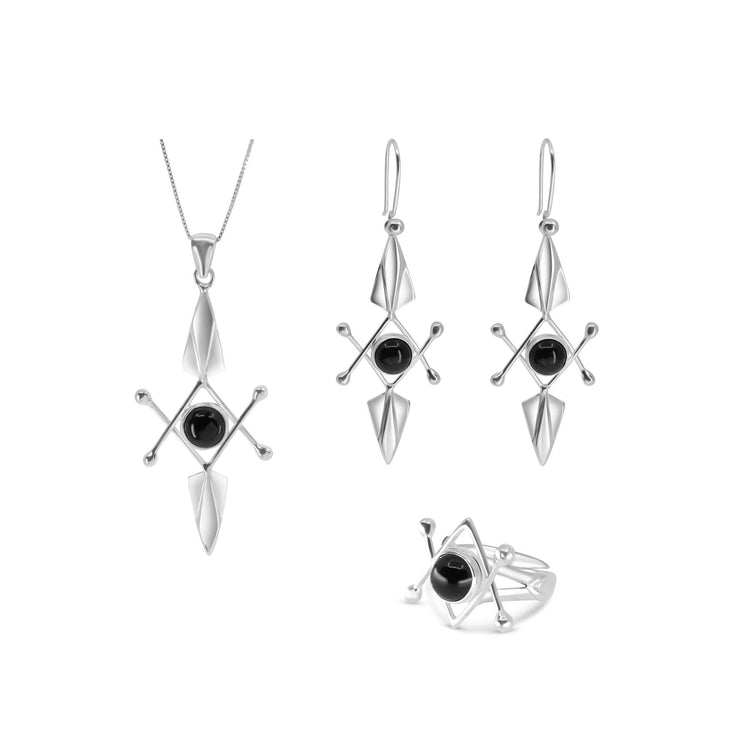 A jewelry set from Kaora Sandara Jewelry, known for its modern geometric design, features a necklace, earrings, and the Energy Protection Ring in sterling silver with black agate. Crafted from sterling silver 925, each piece displays diamond and triangular shapes highlighted by a central black gemstone. The necklace is strung on a thin chain, while the earrings boast a dangling style.