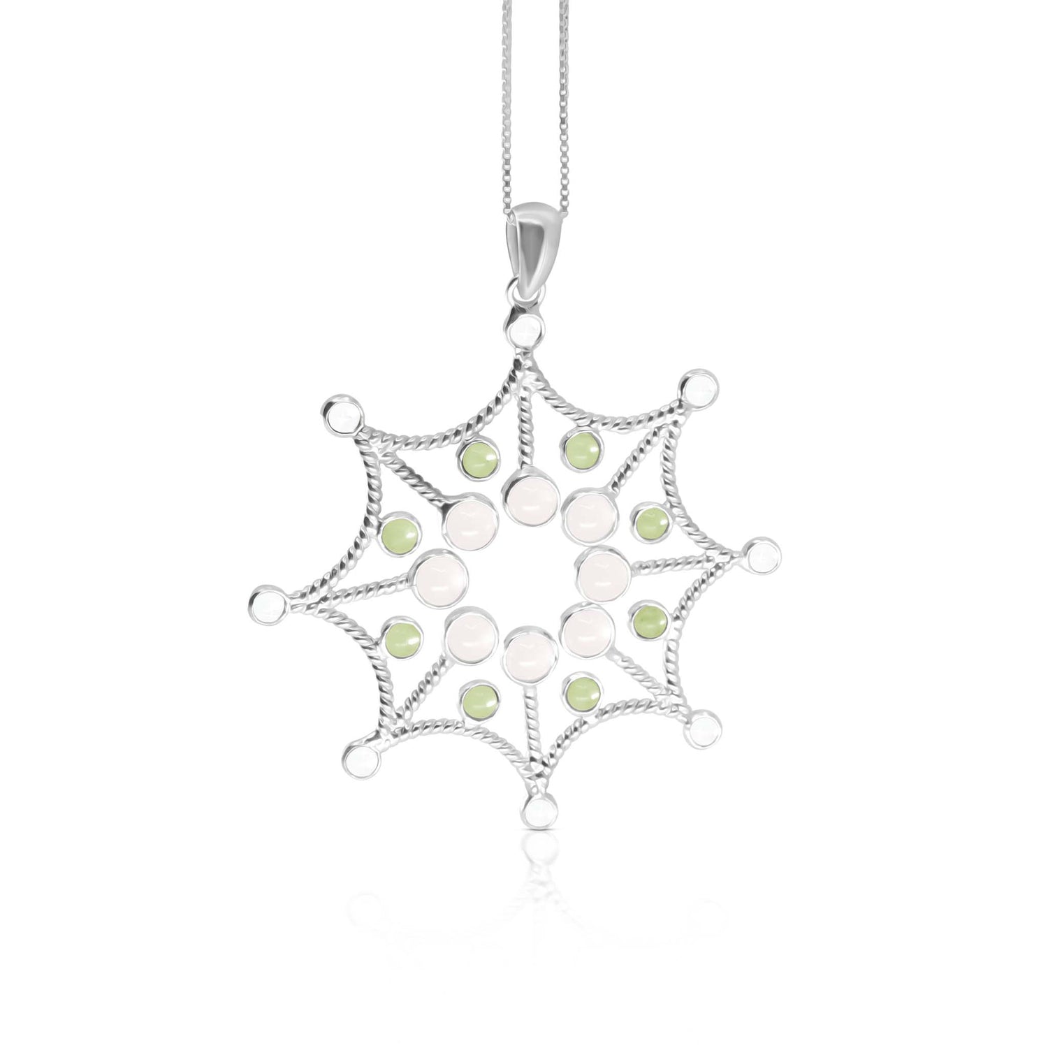 The "Freedom from the Ego Pendant" by Kaora Sandara Jewelry is an intricately designed sterling silver 925 necklace, featuring a symmetrical starburst-like pattern adorned with small white crystals, rose quartz, and green peridot stones. It hangs elegantly from a thin chain.