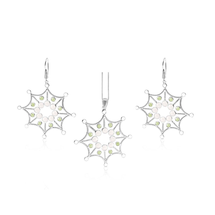 Introducing the Freedom from the Ego Pendant set by Kaora Sandara Jewelry, featuring a stunning pendant and matching earrings. Each piece showcases an intricate starburst design with sparkling crystal, rose quartz, and peridot gemstones set in Sterling Silver 925. The pendant is elegantly displayed on a delicate silver chain.