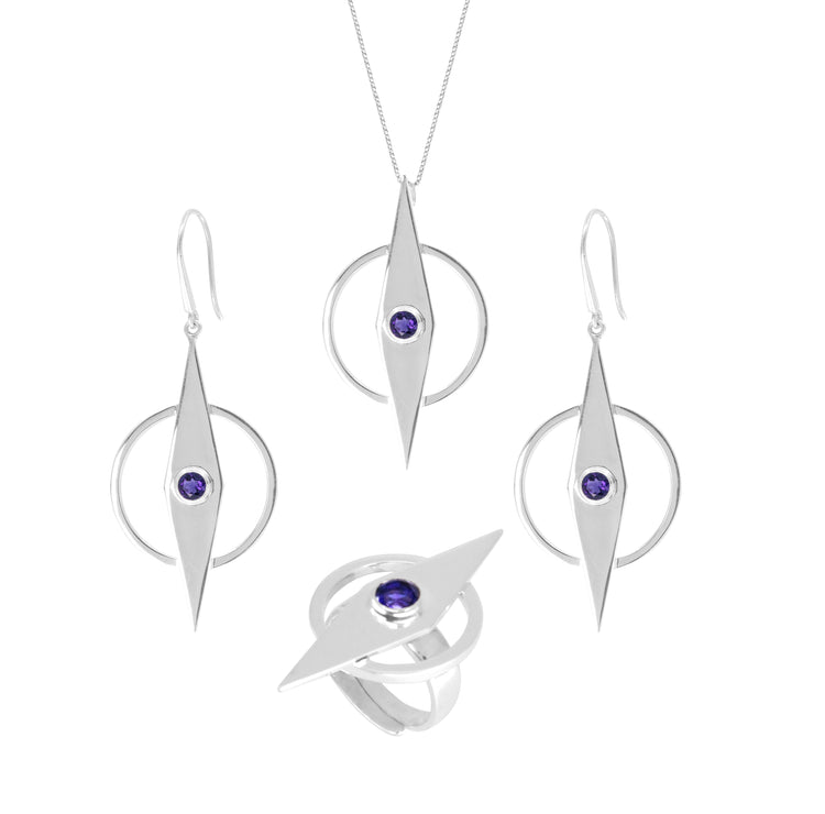 A jewelry set from Kaora Sandara Jewelry includes a necklace, earrings, and a ring. Each piece features a pointed, diamond-shaped Sterling Silver 925 design with a circular purple gem in the center. The necklace and earrings boast Intuition Earhooks – Sterling Silver with Amethyst and have dangling elements, while the ring has a matching central design motif.