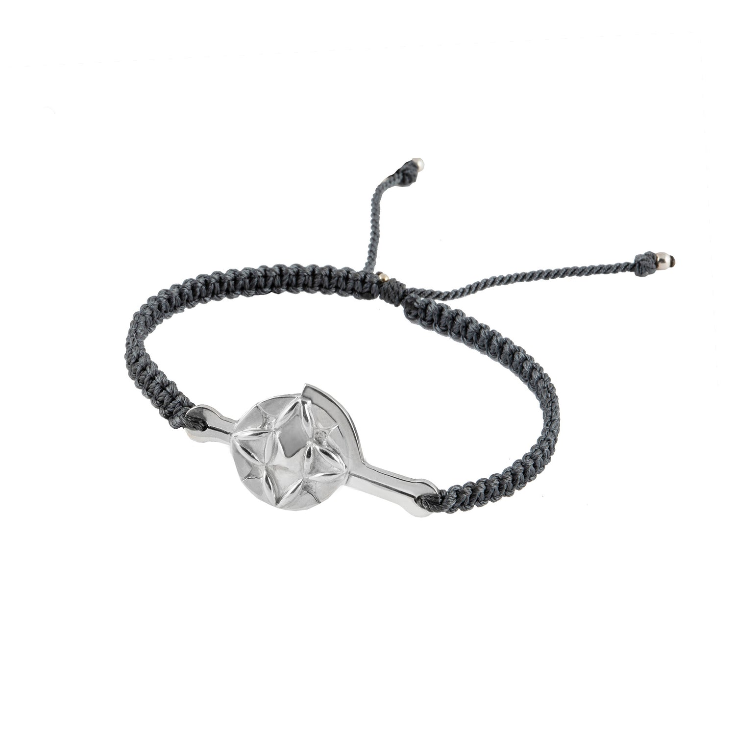 The Silver Male Bracelet On Dark Grey String With Code Transition by Kaora Sandara Jewelry features a Sterling silver 925 charm with a geometric star pattern, centered on a black braided cord bracelet. The bracelet has adjustable ends with small metallic tips, offering a modern and minimalist design that echoes positive vibrations for spiritual development.