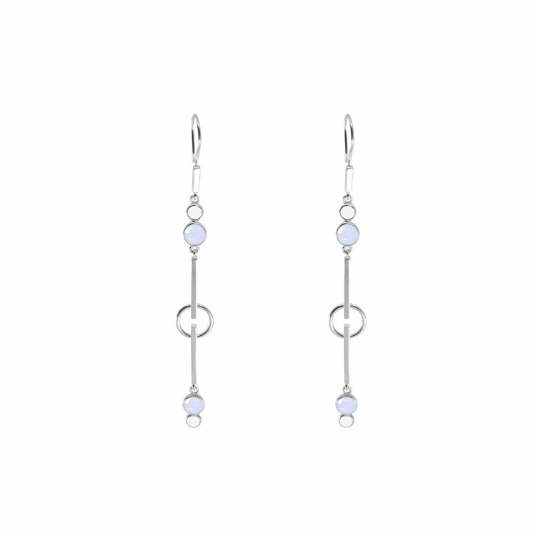 The Silver Earhooks State by Kaora Sandara Jewelry showcases a minimalist design with Sterling Silver 925. Each earring features two small, round light blue Chalcedony gemstones, positioned at the top and bottom, connected by a straight bar intersected by a loop in the middle, and finished with delicate earhooks.