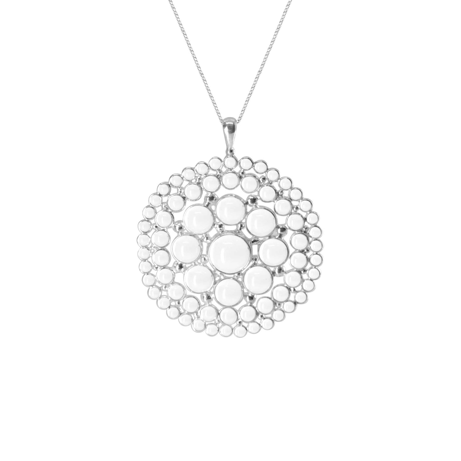 The Purity Pendant by Kaora Sandara Jewelry is a Sterling Silver 925 necklace which features a large circular pendant adorned with transparent rhinestone crystals. The intricately designed pendant showcases several concentric circles made up of smaller circles, giving it a unique and elegant appearance.