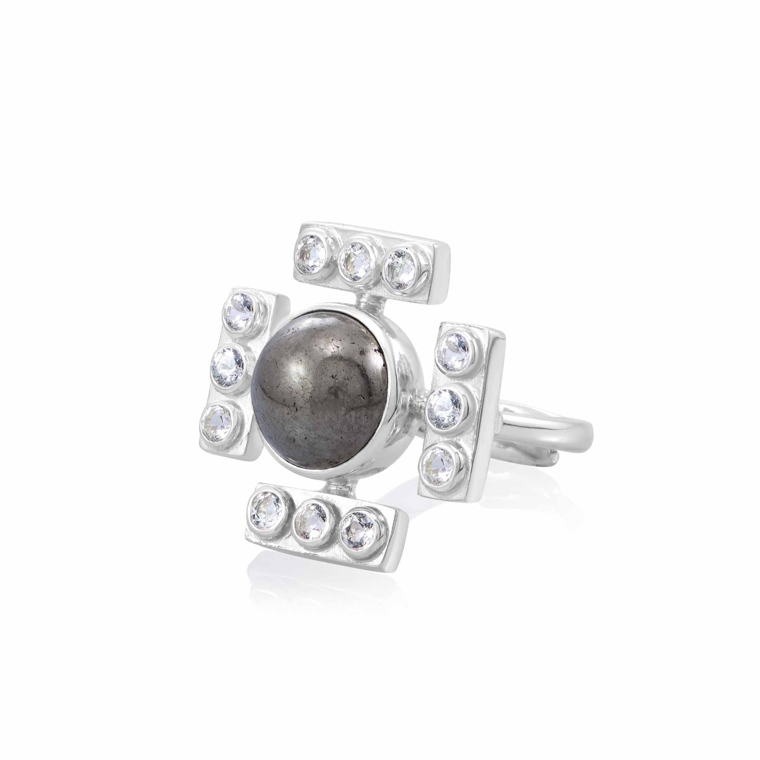 The Confidence Ring by Kaora Sandara Jewelry features a large, round black stone at its center, encased in an intricate Pyrite sterling silver setting. The setting is divided into four segments, each adorned with small, sparkling transparent rhinestone crystals arranged symmetrically around the central stone.