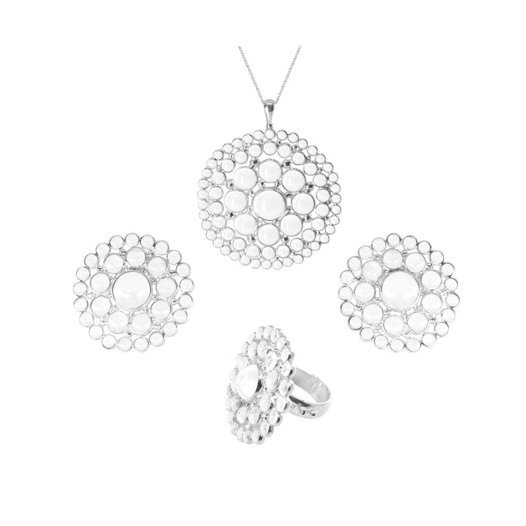 Kaora Sandara Jewelry presents the Purity Pendant – a luxurious sterling silver 925 jewelry set, featuring a necklace, ring, and earrings. Each piece showcases a circular design with a large central gemstone surrounded by smaller gems in an intricate openwork pattern. The sophisticated necklace is elegantly displayed on a fine silver chain, accentuated by a transparent rhinestone crystal for added sophistication. Available in size L.