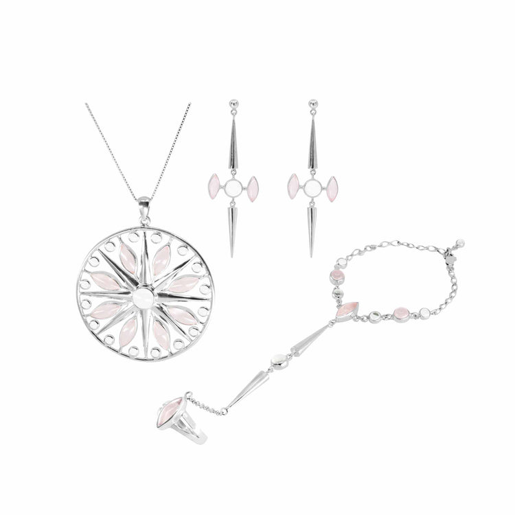 The Kaora Sandara Jewelry set includes the "Life as Art Hand Chain," a sterling silver 925 piece featuring a pendant necklace with a round, intricate floral-like design, matching drop earrings with pointed details, and a hand chain harness adorned with small stones and connected to a ring.