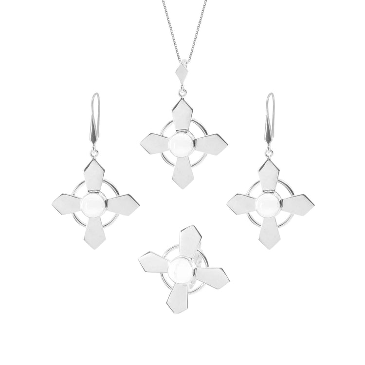 Introducing the Power's Activation Pendant Set from Kaora Sandara Jewelry, featuring a stunning necklace with a crystal pendant and three pairs of earrings. Each piece showcases a geometric design with four triangular shapes radiating from a circular center, all crafted in sleek, polished sterling silver.